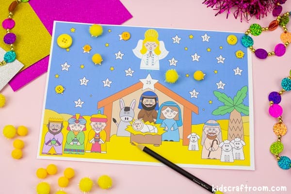 A close up of a Nativity Advent Calendar For Kids. The daily numbered stars are being covered by yellow pompoms and buttons.