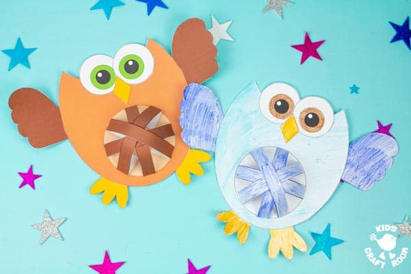 2 Pot Belly Owl crafts on a blue star filled background. The left owl is brown, the right owl is blue and has been coloured in with pencils..