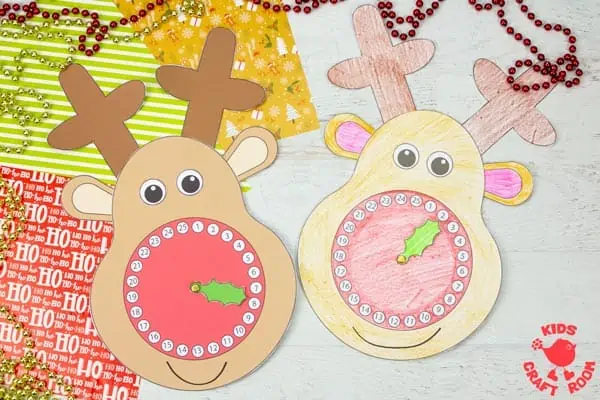 2 Reindeer Christmas Countdown Clocks lying side by side. The left is pre-coloured and the right has been coloured in with pencil crayons.