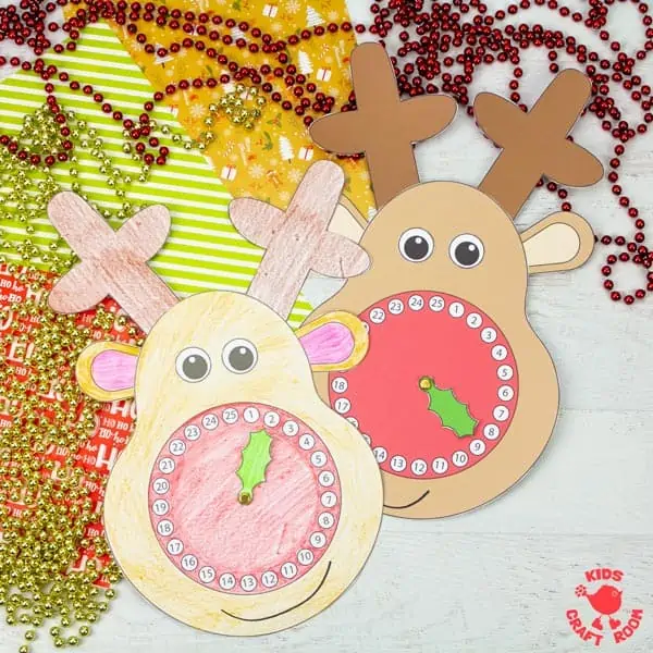 2 Reindeer Christmas Countdown Clocks lying on Christmas gift wrap.