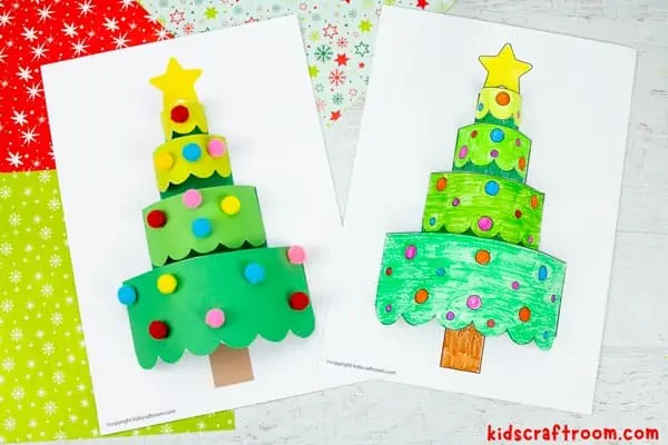 Two 3D Paper Christmas Tree Crafts side by side on a backdrop of Christmas gift wrap. the tree on the left has been decorated with pompoms and the one on the right has been coloured in with pencil crayons.