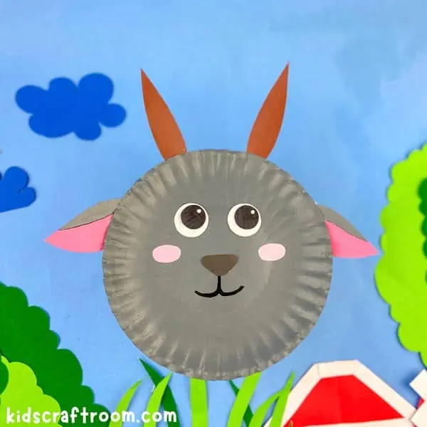 A grey Paper Plate Goat Craft on a blue sky background.