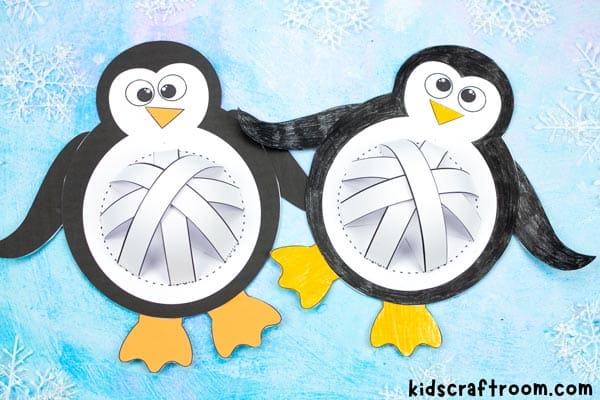 Completed Pot Belly Penguins lying on a blue background. Close up showing 3D tummies. 