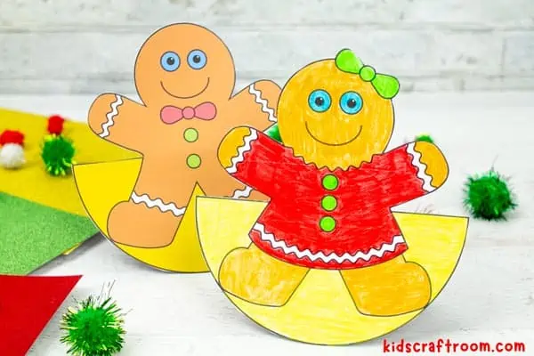 2 Rocking Gingerbread Man Crafts side by side. A boy on the left and a girl on the right.