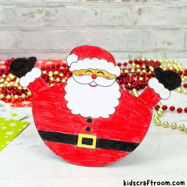 A close up of a hand coloured Rocking Santa Craft.