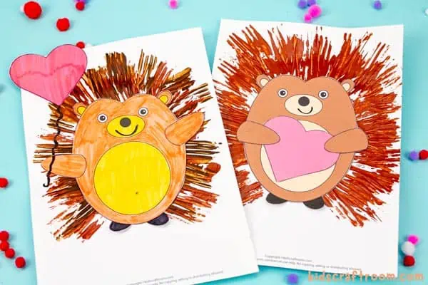 2 Fork Painted Hedgehog Crafts side by side. The left hedgehog holds a heart shaped balloon. The right hedgehog hugs a heart.