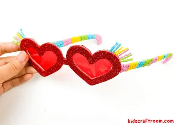 A close up of the side of the Heart Sunglasses Craft. Showing the twine covered arms.