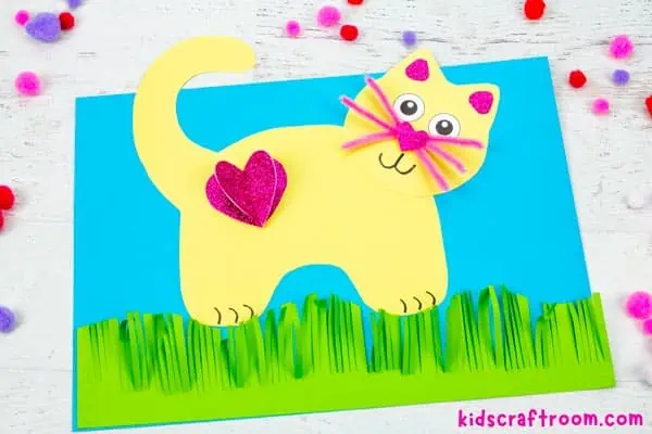 A close up of a yellow Valentine Cat Craft.