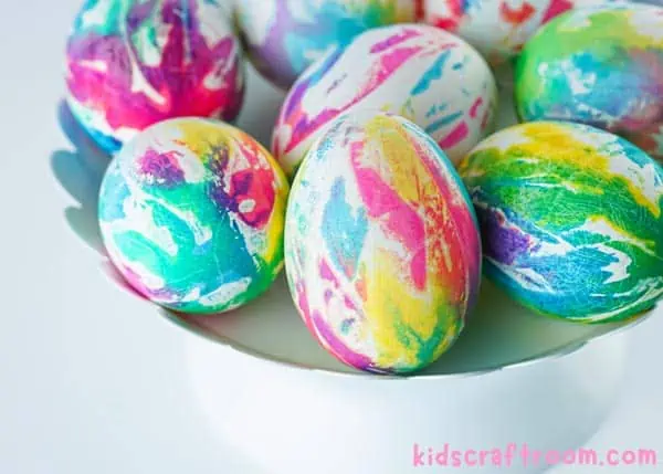 A cloise up of a plate of Tie Dye Easter Eggs viewed from above.