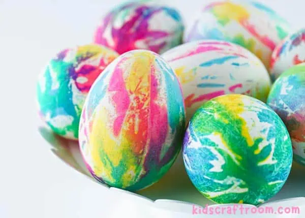 A close up of a plate of Tie Dye Easter Eggs.