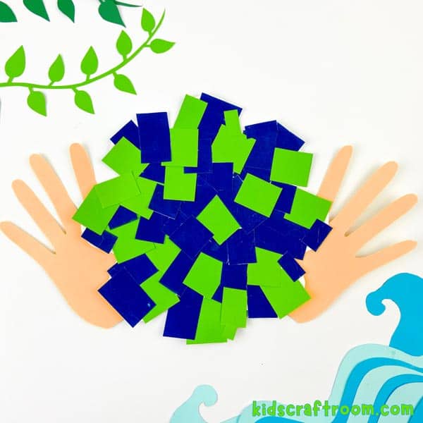 A finished Mosaic Handprint Earth Day Craft on a white background.