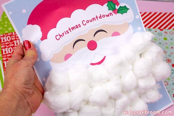 A close up of a completed Santa's Beard Advent Calendar. The beard has been made of cotton balls.