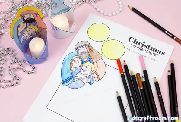A close up of the Christmas tealight holder template featuring Mary, Joseph and Baby Jesus. It is partially colored with pencil crayons.
