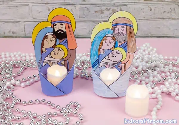 2 printable Nativity Candle Holders featuring Mary, Joseph and Baby Jesus. The one on the left is full color and the one on the right was made from a black and white template that has been colored with pencil crayons.
