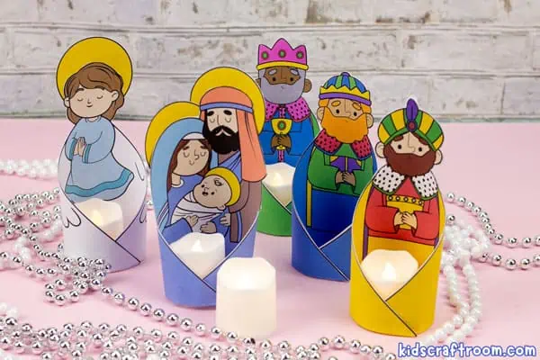 5 printable Nativity Character Candle Holders one features Mary, Joseph and Baby Jesus. The others feature an Angel and 3 Wise Men. They are all full color and have battery tea light lit inside them.