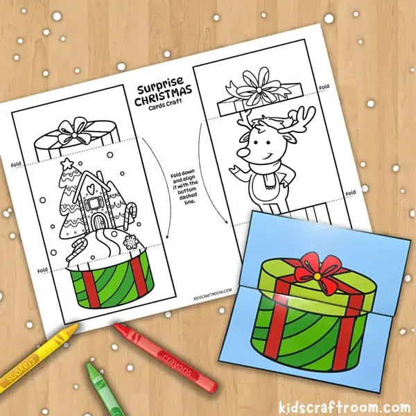 A printable Christmas card coloring sheet featuring a gingerbread house and a reindeer.